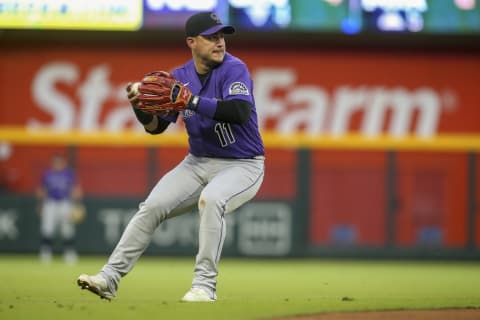 Colorado Rockies shortstop Jose Iglesias throws to first base against the Atlanta Braves. (Brett Davis-USA TODAY Sports)