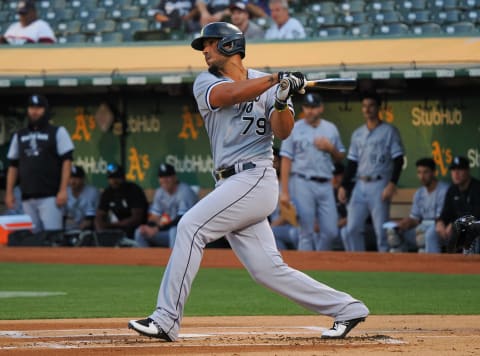 Chicago White Sox first baseman Jose Abreu hits a single against the Oakland Athletics. (Kelley L Cox-USA TODAY Sports)