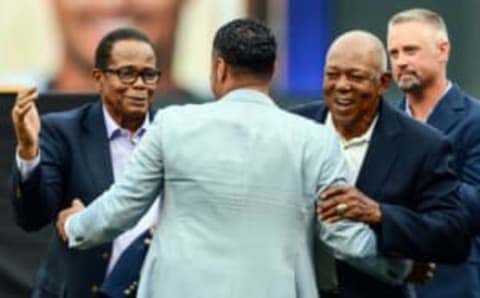 Aug 4, 2018; Minneapolis, MN, USA; Johan Santana (center) is greeted by Hall of Fame players Rod Carew (left) and Tony Oliva (right) as he is inducted into the Minnesota Twins Hall of Fame before the game against the Kansas City Royals at Target Field. Mandatory Credit: Jeffrey Becker-USA TODAY Sports