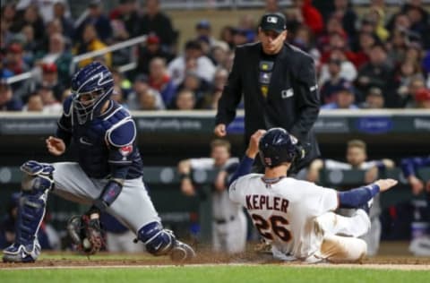 Apr 18, 2017; Minneapolis, MN, USA; Minnesota Twins right fielder Max Kepler (26) slides safe into home beating Cleveland Indians catcher Roberto Perez (55) tag during the fourth inning at Target Field. Mandatory Credit: Jordan Johnson-USA TODAY Sports