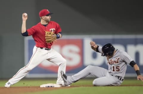 Apr 21, 2017; Minneapolis, MN, USA; Minnesota Twins second baseman Brian Dozier (2) forces out Detroit Tigers right fielder Mikie Mahtook (15) at second base and throws to first base in attempt for a double play in the ninth inning at Target Field. The Twins won 6-3. Mandatory Credit: Jesse Johnson-USA TODAY Sports