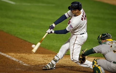 May 2, 2017; Minneapolis, MN, USA; Minnesota Twins first baseman Joe Mauer (7) hits a two-run home run against the Oakland Athletics in the seventh inning at Target Field. Mandatory Credit: Bruce Kluckhohn-USA TODAY Sports