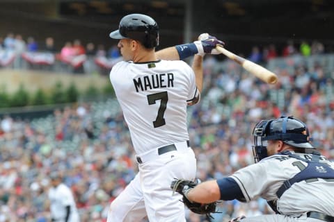 May 29, 2017; Minneapolis, MN, USA; Minnesota Twins first baseman Joe Mauer (7) singles to center scoring designated hitter Robbie Grossman (36, not pictured) during the fifth inning against the Houston Astros at Target Field. Mandatory Credit: Marilyn Indahl-USA TODAY Sports