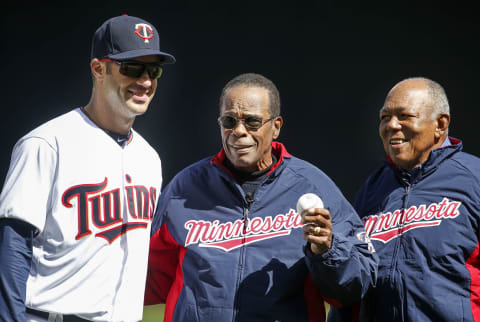 Apr 11, 2016; Minneapolis, MN, USA; Minnesota Twins hall of fame player Rod Carew (center) holds out a ceremonial first pitch brought to him by former teammate Tony Oliva that he threw to first baseman Joe Mauer (7) before the game between the Twins and the Chicago White Sox at Target Field. Mandatory Credit: Bruce Kluckhohn-USA TODAY Sports