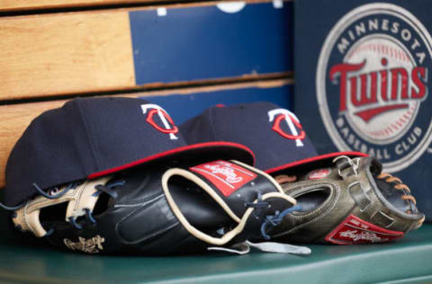 Apr 13, 2017; Detroit, MI, USA; Minnesota Twins hat and glove in the dugout during the game against the Minnesota Twins at Comerica Park. Mandatory Credit: Rick Osentoski-USA TODAY Sports