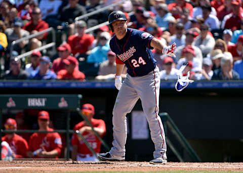 Mar 16, 2017; Jupiter, FL, USA; Minnesota Twins center fielder J.B. Shuck (24) tosses his equipment after drawing a walk during a spring training game against the St. Louis Cardinals at Roger Dean Stadium. Mandatory Credit: Steve Mitchell-USA TODAY Sports