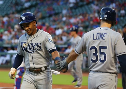 ARLINGTON, TX – SEPTEMBER 17: Mallex Smith #0 slaps hands with Brandon Lowe #35 of the Tampa Bay Rays after scoring on a single by Ji-Man Choi in the first inning against the Texas Rangers at Globe Life Park in Arlington on September 17, 2018 in Arlington, Texas. (Photo by Richard Rodriguez/Getty Images)