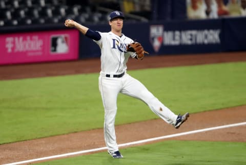 SAN DIEGO, CALIFORNIA – OCTOBER 17: Joey Wendle #18 of the Tampa Bay Rays is unable to make the throw to first to out Jose Altuve #27 of the Houston Astros during the sixth inning in Game Seven of the American League Championship Series at PETCO Park on October 17, 2020 in San Diego, California. Wendle was a bright spot in the postseason but will largely platoon in 2021. (Photo by Sean M. Haffey/Getty Images)