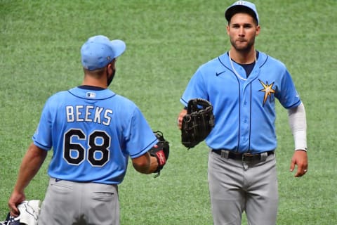 Jalen Beeks #68 and Kevin Kiermaier #39 of the Tampa Bay Rays (Photo by Julio Aguilar/Getty Images)