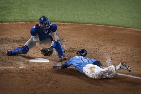 Los Angeles Dodgers catcher Austin Barnes (15) tags out Tampa Bay Rays left fielder Manuel Margot (13) as Margot attempts to steal home during the fourth inning in game five of the 2020 World Series at Globe Life Field. Mandatory Credit: Jerome Miron-USA TODAY Sports