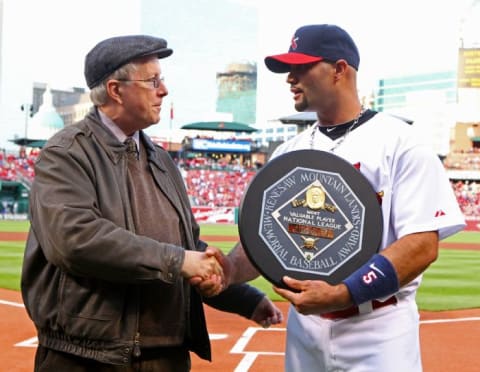 Rick Hummel of the St. Louis Post-Dispatch presented Pujols with the MVP trophy. (Source: Christian Gooden)