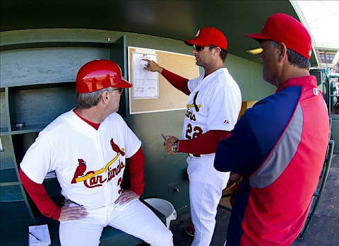 Mar 5, 2012; Jupiter, FL. USA; St. Louis Cardinals manager Mike Matheny (22) checks his lineup card before the game against the Miami Marlins at Roger Dean Stadium. The Marlins defeated the Cardinals 4-3. Mandatory Credit: Scott Rovak-US PRESSWIRE