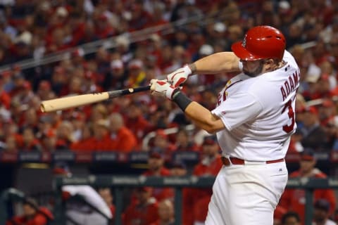 Oct 12, 2014; St. Louis, MO, USA; St. Louis Cardinals first baseman Matt Adams hits a solo home run against the San Francisco Giants during the 8th inning in game two of the 2014 NLCS playoff baseball game at Busch Stadium. Mandatory Credit: Jeff Curry-USA TODAY Sports