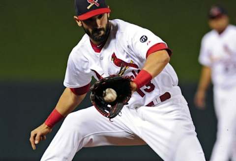 Apr 19, 2015; St. Louis, MO, USA; St. Louis Cardinals third baseman Matt Carpenter (13) fields a ground ball hit by Cincinnati Reds starting pitcher Mike Leake (not pictured) during the fifth inning at Busch Stadium. The Cardinals defeated the Reds 2-1. Mandatory Credit: Jeff Curry-USA TODAY Sports