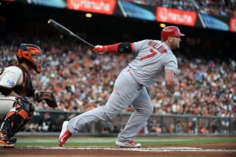 Oct 16, 2014; San Francisco, CA, USA; St. Louis Cardinals left fielder Matt Holliday (7) singles against the San Francisco Giants during the first inning in game five of the 2014 NLCS playoff at AT&T Park. Mandatory Credit: Kyle Terada-USA TODAY Sports