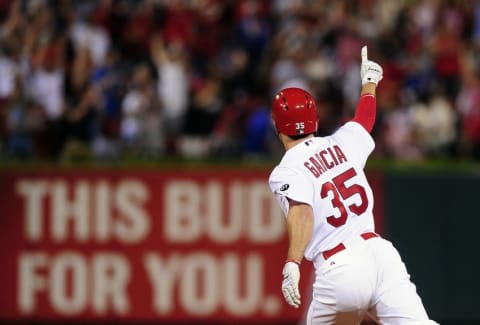 Jun 26, 2015; St. Louis, MO, USA; St. Louis Cardinals pinch hitter Greg Garcia (35) celebrates his game tying solo home run off of Chicago Cubs relief pitcher Pedro Strop (not pictured) during the eighth inning at Busch Stadium. The Cardinals defeated the Cubs 3-2 in ten innings. Mandatory Credit: Jeff Curry-USA TODAY Sports