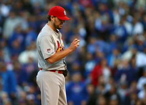 October 13, 2015; Chicago, IL, USA; St. Louis Cardinals starting pitcher John Lackey (41) looks down as he is requested to exchange baseballs during his pitch in the third inning against Chicago Cubs in game four of the NLDS at Wrigley Field. Mandatory Credit: Jerry Lai-USA TODAY Sports