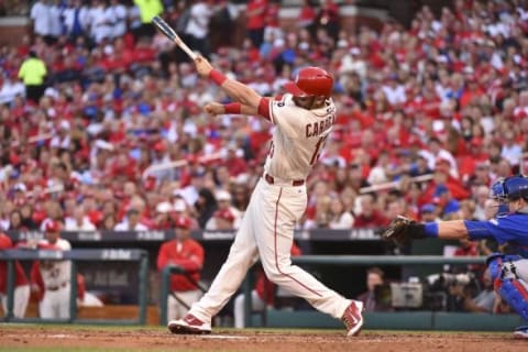 Oct 10, 2015; St. Louis, MO, USA; St. Louis Cardinals third baseman Matt Carpenter (13) loses his bat during the third inning in game two of the NLDS against the Chicago Cubs at Busch Stadium. Mandatory Credit: Jasen Vinlove-USA TODAY Sports