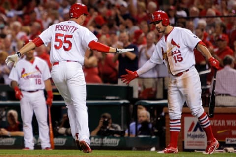 Sep 24, 2015; St. Louis, MO, USA; St. Louis Cardinals left fielder Stephen Piscotty (55) is congratulated by Randal Grichuk as he crosses home plate after hitting a solo home run during the fourth inning of a baseball game against the Milwaukee Brewers at Busch Stadium. Mandatory Credit: Scott Kane-USA TODAY Sports