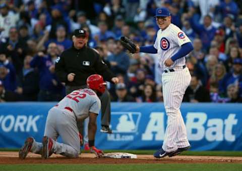 October 13, 2015; Chicago, IL, USA; St. Louis Cardinals right fielder Jason Heyward (22) is out at first on a pick off in the third inning against the tag of Chicago Cubs first baseman Anthony Rizzo (44) in game four of the NLDS at Wrigley Field. Mandatory Credit: Jerry Lai-USA TODAY Sports