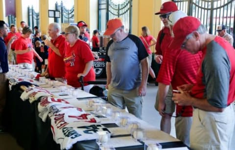 Mar 11, 2015; Lake Buena Vista, FL, USA; Atlanta Braves fans check out items that are up for auction during a spring training baseball game at Champion Stadium. The St. Louis Cardinals beat the Atlanta Braves 6-2. Mandatory Credit: Reinhold Matay-USA TODAY Sports