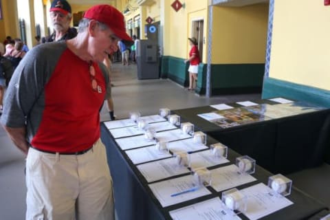 Mar 11, 2015; Lake Buena Vista, FL, USA; Atlanta Braves fans check out items that are up for auction during a spring training baseball game at Champion Stadium. The St. Louis Cardinals beat the Atlanta Braves 6-2. Mandatory Credit: Reinhold Matay-USA TODAY Sports