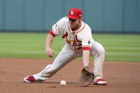 Oct 10, 2015; St. Louis, MO, USA; St. Louis Cardinals first baseman Brandon Moss (21) fields a ground ball during the fourth inning in game two of the NLDS against the Chicago Cubs at Busch Stadium. Mandatory Credit: Jeff Curry-USA TODAY Sports