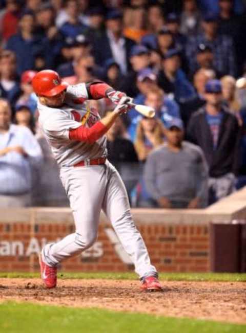 Jul 8, 2015; Chicago, IL, USA; St. Louis Cardinals shortstop Jhonny Peralta hits a two run home run in the ninth inning against the Chicago Cubs at Wrigley Field. Mandatory Credit: Mark J. Rebilas-USA TODAY Sports