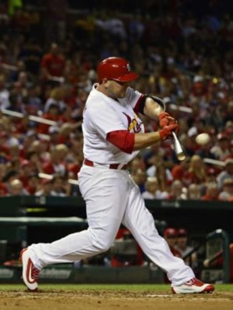 Sep 23, 2015; St. Louis, MO, USA; St. Louis Cardinals left fielder Matt Holliday (7) hits a one run double off of Cincinnati Reds starting pitcher Brandon Finnegan (not pictured) during the third inning at Busch Stadium. Mandatory Credit: Jeff Curry-USA TODAY Sports