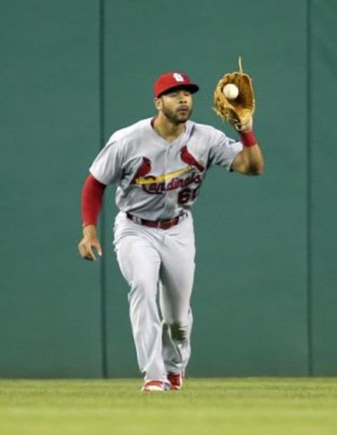 Jul 11, 2015; Pittsburgh, PA, USA; St. Louis Cardinals center fielder Thomas Pham (60) makes a catch in the outfield against the Pittsburgh Pirates during the sixth inning at PNC Park. Mandatory Credit: Charles LeClaire-USA TODAY Sports