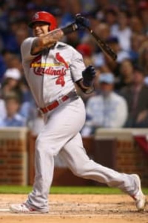 Oct 12, 2015; Chicago, IL, USA; St. Louis Cardinals catcher Yadier Molina (4) reacts after swinging at a pitch during the fourth inning against the Chicago Cubs in game three of the NLDS at Wrigley Field. Mandatory Credit: Jerry Lai-USA TODAY Sports