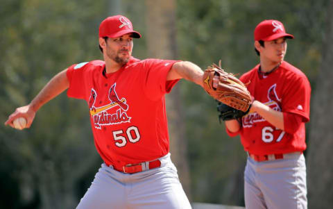 Feb 18, 2016; Jupiter, FL, USA; St. Louis Cardinals starting pitcher Adam Wainwright (50) throws during warm up drills at Roger Dean Stadium. Mandatory Credit: Steve Mitchell-USA TODAY Sports