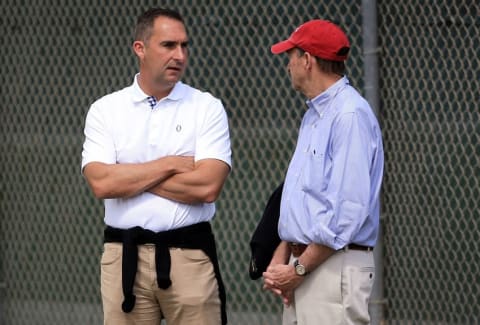 Feb 18, 2016; Jupiter, FL, USA; St. Louis Cardinals general manager John Mozeliak (left) talks with chairman and chief executive officer William O. DeWitt, Jr. (center) at Roger Dean Stadium. Mandatory Credit: Steve Mitchell-USA TODAY Sports