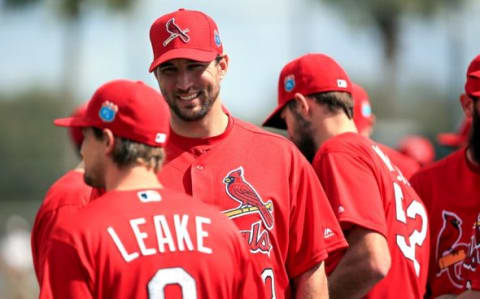 Feb 18, 2016; Jupiter, FL, USA; St. Louis Cardinals starting pitcher Adam Wainwright (50) talks with starting pitcher Mike Leake (8) before warm ups at Roger Dean Stadium. Mandatory Credit: Steve Mitchell-USA TODAY Sports