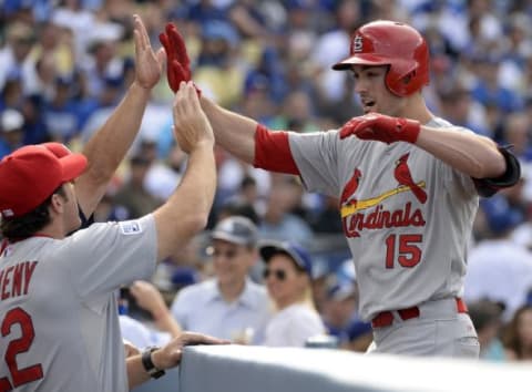 Oct 3, 2014; Los Angeles, CA, USA; St. Louis Cardinals center fielder Randal Grichuk (15) is congratulated manager Mike Matheny (22) after he hits a solo home run in the first inning against the Los Angeles Dodgers in game one of the 2014 NLDS playoff baseball game at Dodger Stadium. Mandatory Credit: Richard Mackson-USA TODAY Sports