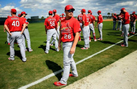 Feb 18, 2016; Jupiter, FL, USA; St. Louis Cardinals relief pitcher Seung Hwan Oh (26) looks on during warm up drills at Roger Dean Stadium. Mandatory Credit: Steve Mitchell-USA TODAY Sports