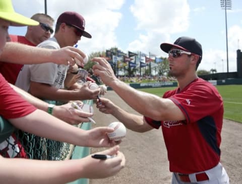 Mar 11, 2015; Lake Buena Vista, FL, USA; St. Louis Cardinals center fielder Randal Grichuk (15) signs autographs before a spring training baseball game against the Atlanta Braves at Champion Stadium. Mandatory Credit: Reinhold Matay-USA TODAY Sports