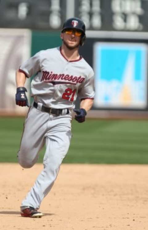 Jul 19, 2015; Oakland, CA, USA; Minnesota Twins left fielder Shane Robinson (21) runs to third base for a triple against the Oakland Athletics during the ninth inning at O.co Coliseum. The Athletics won 14-1. Mandatory Credit: Kelley L Cox-USA TODAY Sports