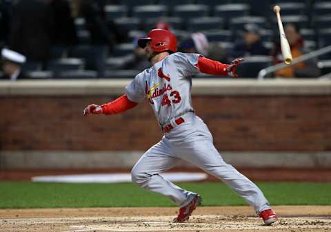 Apr 23, 2014; New York, NY, USA; St. Louis Cardinals right fielder Shane Robinson (43) throws his bat after hitting a single against the New York Mets during the second inning at Citi Field. Mandatory Credit: Adam Hunger-USA TODAY Sports