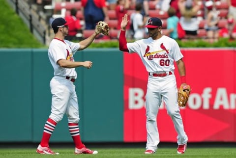 Jul 5, 2015; St. Louis, MO, USA; St. Louis Cardinals center fielder Thomas Pham (60) celebrates with left fielder Randal Grichuk (15) after defeating the San Diego Padres at Busch Stadium. The Cardinals won 3-1. Mandatory Credit: Jeff Curry-USA TODAY Sports