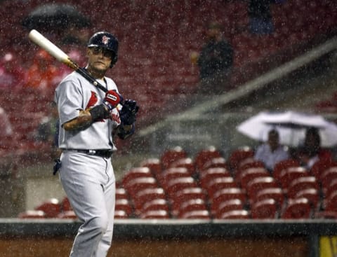 Sep 11, 2015; Cincinnati, OH, USA; St. Louis Cardinals catcher Yadier Molina walks off the field during a rain delay in the eighth inning during game against the Cincinnati Reds at Great American Ball Park. Mandatory Credit: David Kohl-USA TODAY Sports