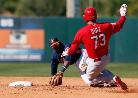 Mar 4, 2016; Kissimmee, FL, USA; Houston Astros second baseman Tony Kemp (78) tags St. Louis Cardinals player Aledmys Diaz (73) as he slides into second base for the out during the inning at Osceola County Stadium. Mandatory Credit: Butch Dill-USA TODAY Sports