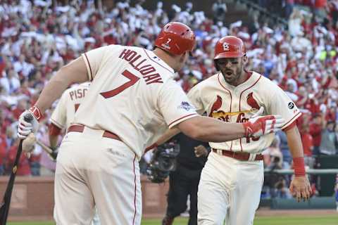 Oct 10, 2015; St. Louis, MO, USA; St. Louis Cardinals third baseman Matt Carpenter (right) is congratulated by left fielder Matt Holliday (7) for hitting a solo home run during the first inning in game two of the NLDS against the Chicago Cubs at Busch Stadium. Mandatory Credit: Jeff Curry-USA TODAY Sports