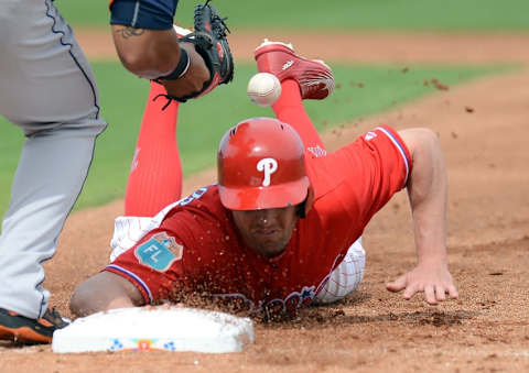 Mar 3, 2016; Clearwater, FL, USA; Philadelphia Phillies outfielder Peter Bourjos (17) slides back to first base on a pickoff attempt in the first inning of the spring training game against the Houston Astros at Bright House Field. Mandatory Credit: Jonathan Dyer-USA TODAY Sports