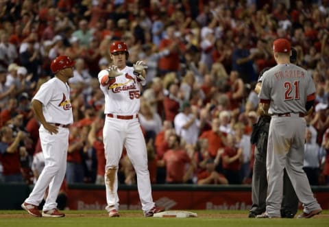 Sep 21, 2015; St. Louis, MO, USA; St. Louis Cardinals left fielder Stephen Piscotty (55) celebrates after driving in the go ahead run on a double off of Cincinnati Reds relief pitcher J.J. Hoover (not pictured) during the eighth inning at Busch Stadium. The Cardinals defeated the Reds 2-1. Mandatory Credit: Jeff Curry-USA TODAY Sports