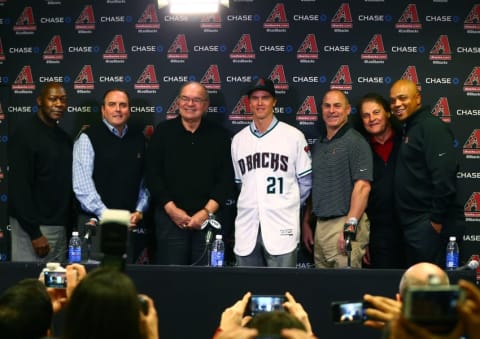 Dec 11, 2015; Phoenix, AZ, USA; (From left) general manager Dave Stewart , team president Derrick Hall , managing general partner Ken Kendrick , Arizona Diamondbacks pitcher Zack Greinke , manager Chip Hale , chief baseball officer Tony La Russa and senior vice president of baseball operations De Jon Watson pose for a group photo during a press conference at Chase Field . Mandatory Credit: Mark J. Rebilas-USA TODAY Sports