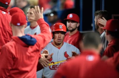 Apr 9, 2016; Atlanta, GA, USA; St. Louis Cardinals second baseman Kolten Wong (16) celebrates with teammates in the dugout after scoring on a wild pitch against the Atlanta Braves during the seventh inning at Turner Field. Mandatory Credit: Dale Zanine-USA TODAY Sports