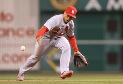 Apr 6, 2016; Pittsburgh, PA, USA; St. Louis Cardinals second baseman Kolten Wong (16) commits an error against the Pittsburgh Pirates during the seventh inning at PNC Park. The Pirates won 5-1. Mandatory Credit: Charles LeClaire-USA TODAY Sports