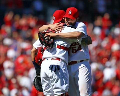 Apr 14, 2016; St. Louis, MO, USA; St. Louis Cardinals starting pitcher Jaime Garcia (54) is congratulated by catcher Yadier Molina (4) after throwing a complete game one hitter against the Milwaukee Brewers at Busch Stadium. The Cardinals won the game 7-0. Mandatory Credit: Billy Hurst-USA TODAY Sports