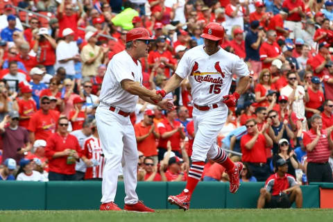 May 25, 2016; St. Louis, MO, USA; St. Louis Cardinals center fielder Randal Grichuk (15) is congratulated by third base coach Chris Maloney after hitting a home run off of Chicago Cubs starting pitcher Jake Arrieta (not pictured) during the second inning at Busch Stadium. Mandatory Credit: Billy Hurst-USA TODAY Sports